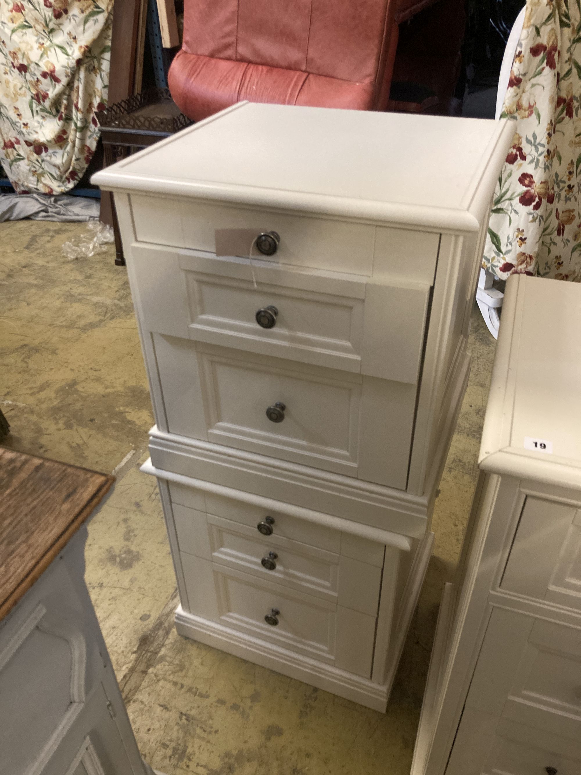 A contemporary white five drawer chest, together with a pair of matching three drawer bedside chests, larger width 105cm depth 50cm hei